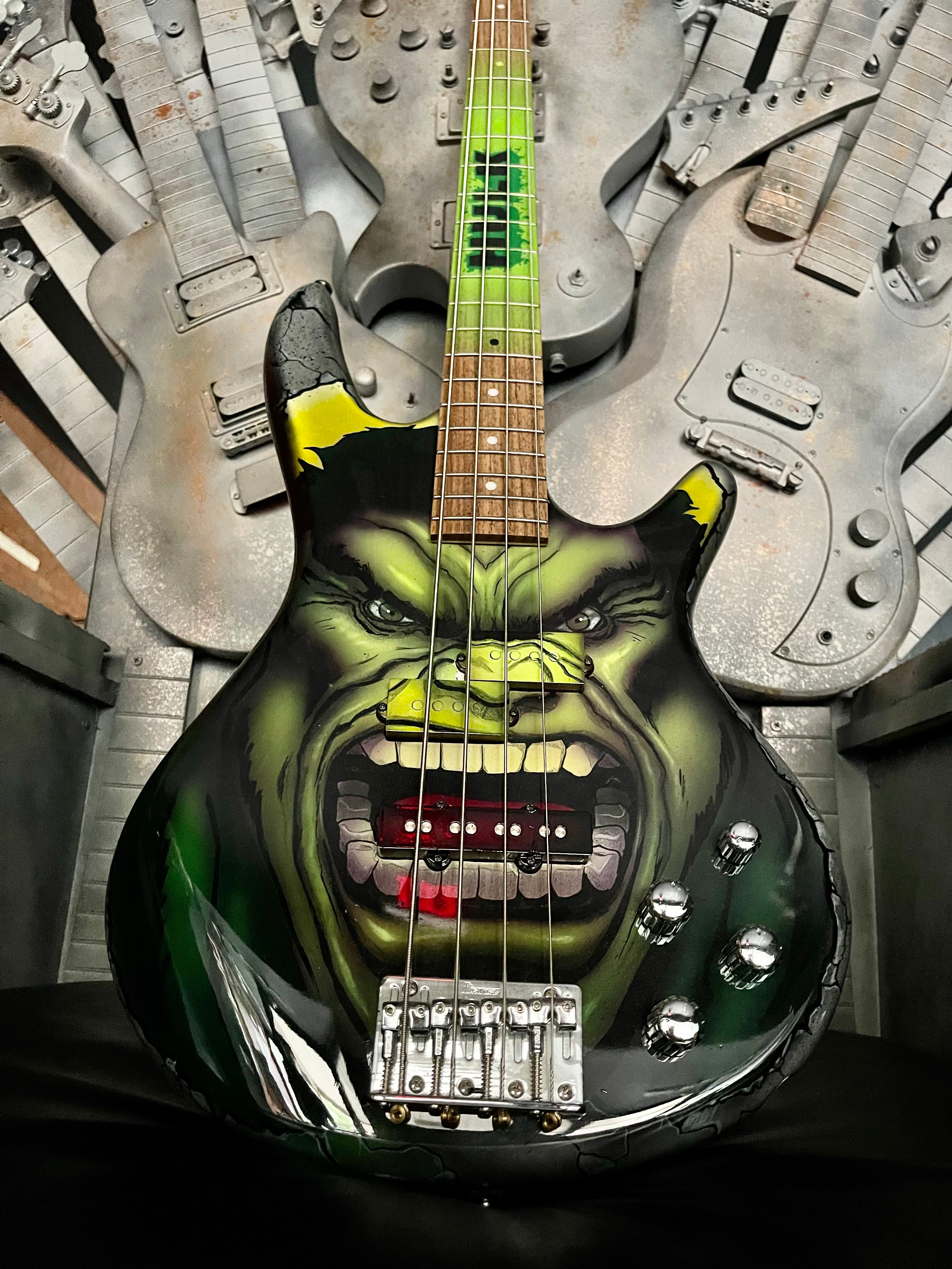 Custom painted store bass guitars